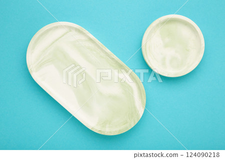 Mint plaster trays on blue background. Stands for candles or jewelry Mint plaster trays on blue background. Stands for candles or jewelry 124090218