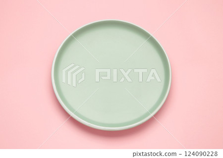 Empty mint ceramic round plate on pink background with clipping path Empty mint ceramic round plate on pink background with clipping path 124090228