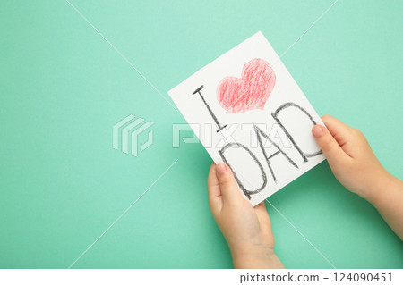 Little girl made greeting postcard for father's. I love dad. Happy Father's Day 124090451