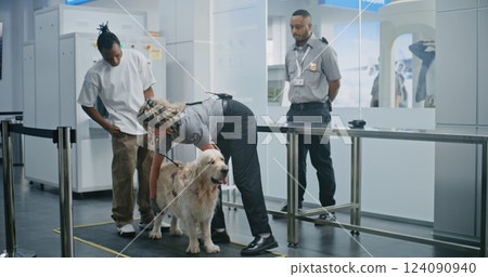 Man with Pet During Screening Procedures in Airport Terminal: Female TSA Officer Scanning Dog 124090940