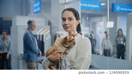 Airport Terminal: Portrait of Happy Woman with Dog Smiling, Looking at Camera 124090959