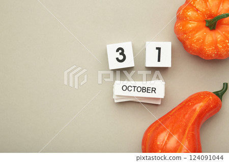 Happy Halloween day with pumpkin and 31 October calendar on grey background. Trick or Threat, Hello October, fall autumn, Festive, party and holiday concept Happy Halloween day with pumpkin and 31 October calendar on grey background. Trick or Threat, Hello October, fall autumn, Festive, party and holiday concept 124091044