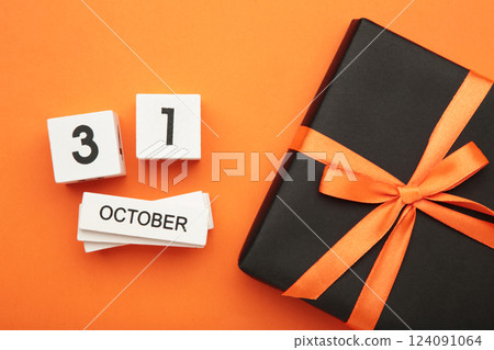 Happy Halloween day with pumpkin and 31 October calendar on orange background. Trick or Threat, Hello October, fall autumn, Festive, party and holiday concept Happy Halloween day with pumpkin and 31 October calendar on orange background. Trick or Threat, Hello October, fall autumn, Festive, party and holiday concept 124091064