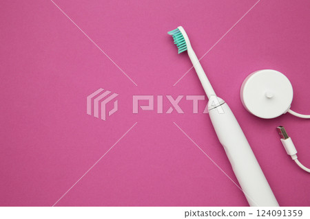 Smart electric toothbrush on pink background. Healthy teeth. Dentistry. Medical robot. Space for text Smart electric toothbrush on pink background. Healthy teeth. Dentistry. Medical robot. Space for text 124091359