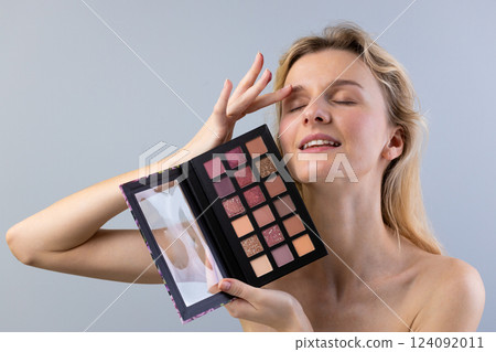 Captivating Beauty: A Model Gracefully Showcases a Stunning Makeup Palette While Radiating Confidence and Joy with Her Elegant Pose and Expressive Facial Features Captivating Beauty: A Model Gracefully Showcases a Stunning Makeup Palette While Radiating Confidence and Joy with Her Elegant Pose and Expressive Facial Features 124092011