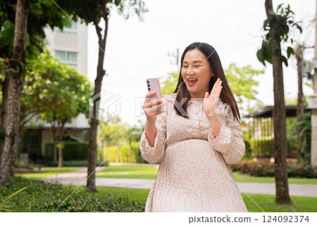 Pregnant woman portrait outdoors 124092374