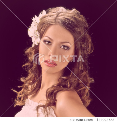 beauty Woman with flowers in hairstyle 124092728