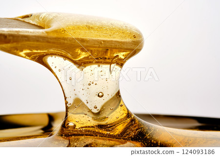 Photo of a sugar paste for depilation hair removal procedure. Texture. Photo of a sugar paste for depilation hair removal procedure. Texture. 124093186