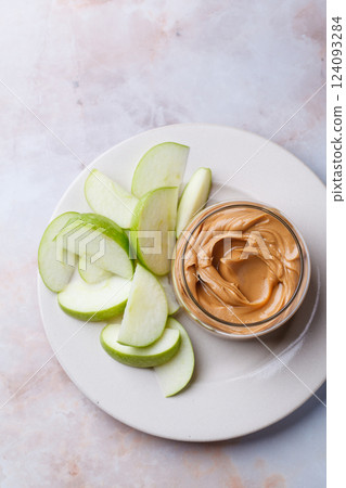 Cashew homemade nut butter with green apple. Vegan snack concept. 124093284