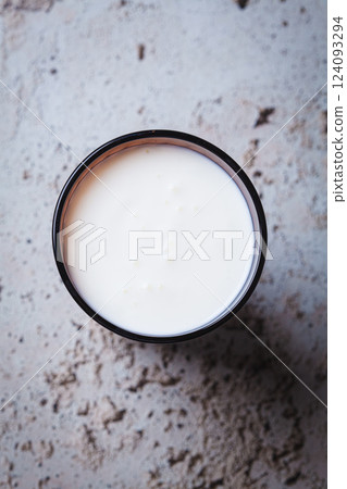 Kefir in a brown glass, top view. Kefir in a brown glass, top view. 124093294