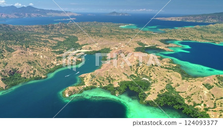 Capturing the stunning aerial view of Komodo national park, Indonesia, reveals turquoise waters embracing lush islands in a vibrant tapestry of nature's beauty Capturing the stunning aerial view of Komodo national park, Indonesia, reveals turquoise waters embracing lush islands in a vibrant tapestry of nature's beauty 124093377