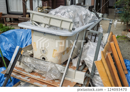 Bathtub waste removed during bathroom renovation 124093470