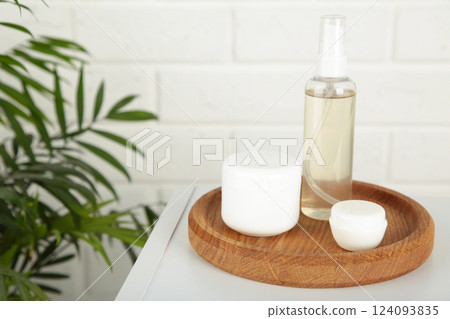 Natural cosmetic products on light background. Cream, mask, lotion for face on table. Natural cosmetic products on light background. Cream, mask, lotion for face on table. 124093835