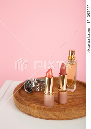 Cosmetic set on light dressing table on pink background 124093915