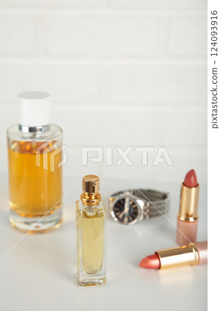 Cosmetic set on light dressing table on light background 124093916