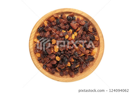 Raisins in wooden bowl isolated on white background. Raisins in wooden bowl isolated on white background. 124094062