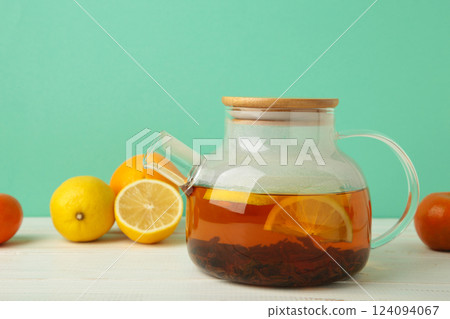 Black tea with lemon on mint background Black tea with lemon on mint background 124094067