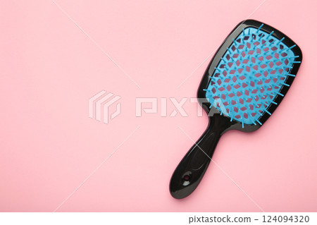 Plastic hairbrushes on pink background. Space for text 124094320