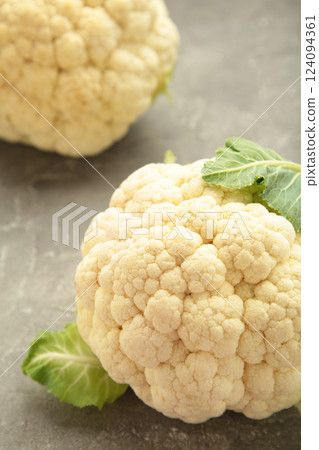 Fresh organic cauliflower on grey background. Vertical photo 124094361