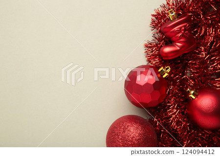 Christmas decorations concept. Red Christmas toys on grey background. Christmas decorations concept. Red Christmas toys on grey background. 124094412