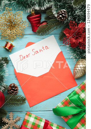 Dear Santa - letter to Santa Claus with Christmas toys on blue background. Dear Santa - letter to Santa Claus with Christmas toys on blue background. 124094479