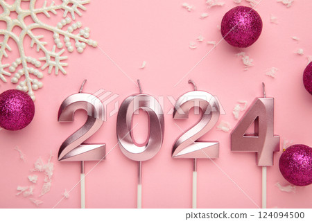 2024 Happy New Year and pink Christmas decoration on pink background 2024 Happy New Year and pink Christmas decoration on pink background 124094500