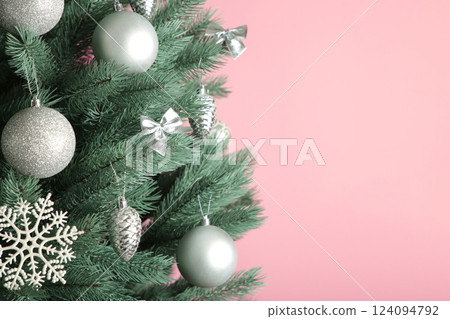 Christmas tree with silver balls on pink background. Christmas card with white silver decor Christmas tree with silver balls on pink background. Christmas card with white silver decor 124094792