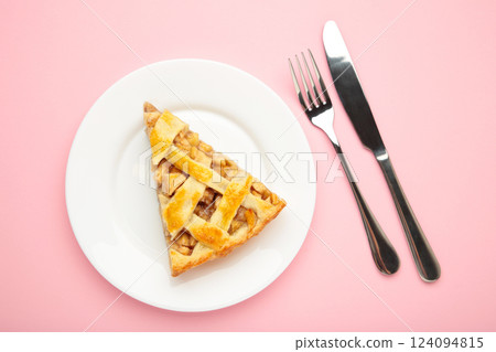 Homemade organic apple pie dessert ready to eat on pink background. Homemade organic apple pie dessert ready to eat on pink background. 124094815
