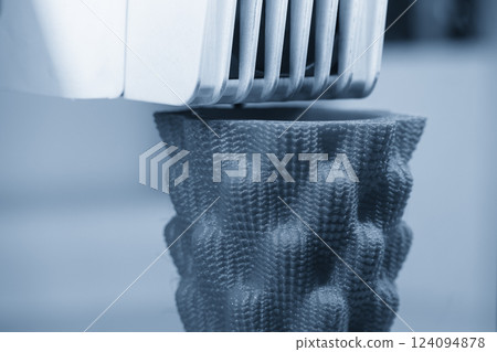 Close up scene the additive manufacturing by 3D printer machine in the light blue scene. 124094878