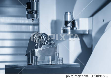 The CMM machine measure the lens reflection mold in the light blue scene. 124094882