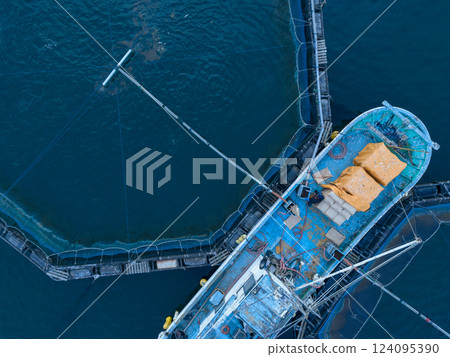 Aquaculture rafts and fishing boats on the sea Aquaculture rafts and fishing boats on the sea 124095390