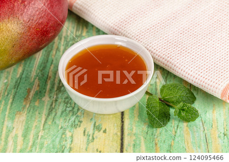 Sweet dessert orange mango puree 124095466