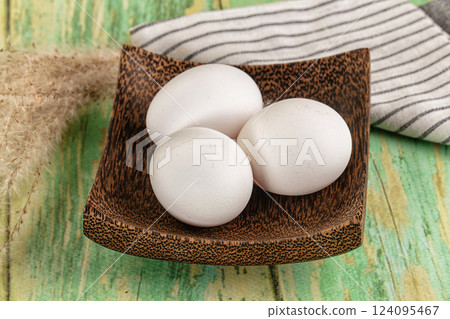 Raw white uncooked chicken eggs Raw white uncooked chicken eggs 124095467