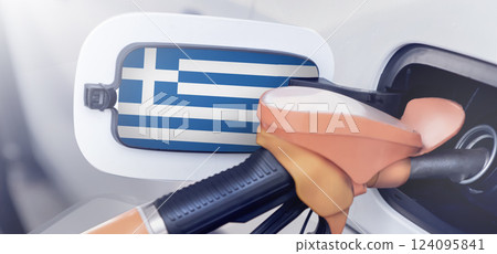 Greece flag on the lid of the gas tank of a car at a gas station in close-up. High or low gasoline prices at Greek gas stations. Gasoline prices are rising in Greece due to a shortage of diesel fuel. 124095841