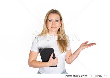 Young blonde business woman wear white shirt white t-shirt writing down in notebook diary remind memories make list dreams isolated on white background studio People lifestyle concept 124096155