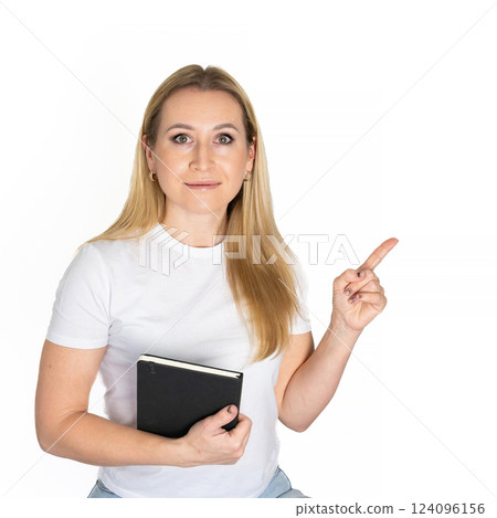 Young blonde business woman wear white shirt white t-shirt writing down in notebook diary remind memories make list dreams isolated on white background studio People lifestyle concept 124096156