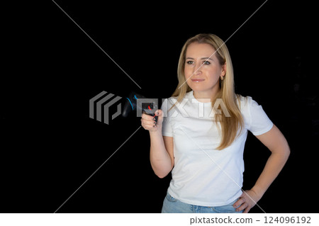 Photo of blonde happy excited crazy smiling woman playing videogames addicted to playstation isolated black background. gamer girl 124096192