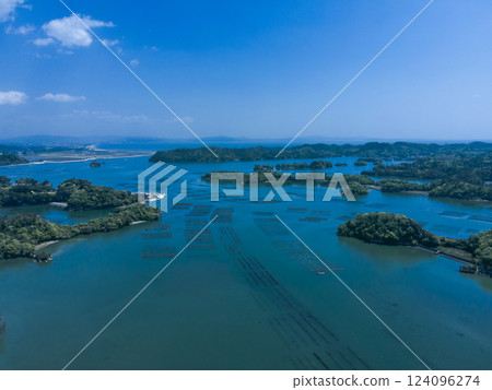 Oyster farming facilities spread out over the blue sea 124096274