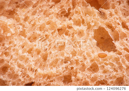 Macro photo of bread texture. Buckwheat bread as a background. Baguette macro. 124096276