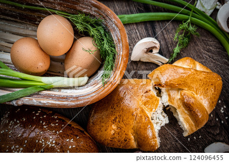 Pie and homemade bread, pizza or pie ingridients, food flat lay on kitchen table background. Working with butter, milk, yeast, flour, eggs, sugar pastry or bakery cooking. Text space 124096455