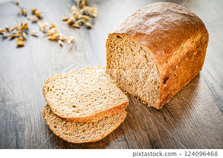 Whole Grain Healthy Sandwich Bread Square Slices, Supermarket Bread for Toasts, Soft Sandwich Loaf Pieces on wooden Background wheat bread Whole Grain Healthy Sandwich Bread Square Slices, Supermarket Bread for Toasts, Soft Sandwich Loaf Pieces on wooden Background wheat bread 124096468