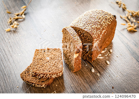 Whole Grain Healthy Sandwich Bread Square Slices, Supermarket Bread for Toasts, Soft Sandwich Loaf Pieces on wooden Background wheat bread Whole Grain Healthy Sandwich Bread Square Slices, Supermarket Bread for Toasts, Soft Sandwich Loaf Pieces on wooden Background wheat bread 124096470