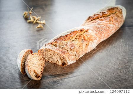 Craft sliced bread on the table at the bakery. The concept of small industries and healthy food Craft sliced bread on the table at the bakery. The concept of small industries and healthy food 124097112