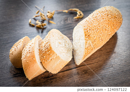 Craft sliced bread on the table at the bakery. The concept of small industries and healthy food Craft sliced bread on the table at the bakery. The concept of small industries and healthy food 124097122