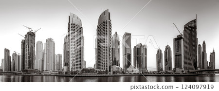 Skyscrapers and Urban city skyline over water, black and white style, city background, Dubai Marina bay UAE 124097919