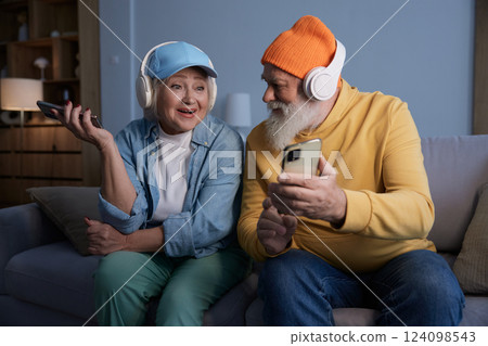 Trendy fashion senior couple using modern gadgets for fun and relax 124098543