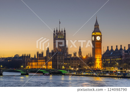 The Houses of Parliament and Big Ben glow under the night sky in London, while Westminster Bridge spans the river, creating a picturesque setting at dusk. The Houses of Parliament and Big Ben glow under the night sky in London, while Westminster Bridge spans the river, creating a picturesque setting at dusk. 124098790