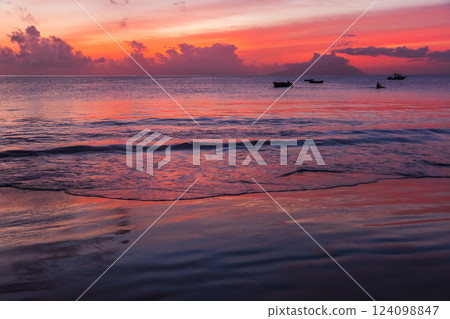 Beautiful oceanview at sunset showcasing vibrant colors, serene waves Beautiful oceanview at sunset showcasing vibrant colors, serene waves 124098847