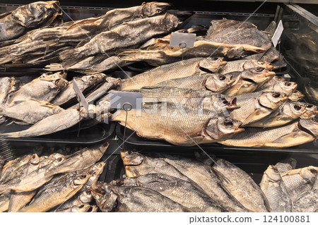 Freshly prepared dried fish displayed in a market for local customers 124100881