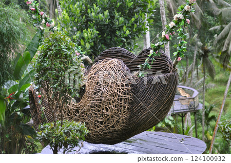 Wicker basket as a swing at Ceking Rice Terrace or Tegalalang Rice Terrace, Ubud, Bali at Indonesia Wicker basket as a swing at Ceking Rice Terrace or Tegalalang Rice Terrace, Ubud, Bali at Indonesia 124100932